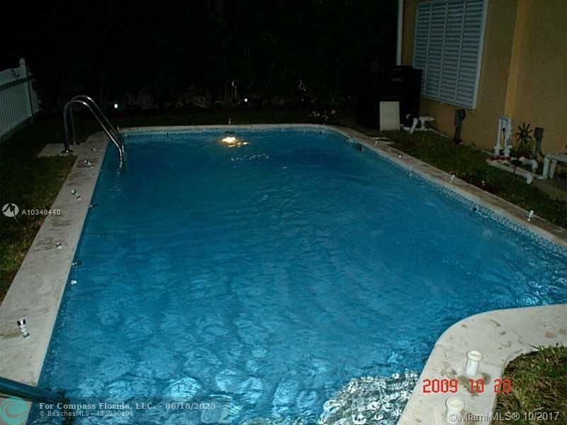 9324 Abbott Avenue Surfside, FL 33154 - Photo 19 of 33 a view of swimming pool from a yard