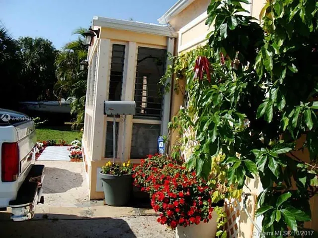 front view of a house with a tree