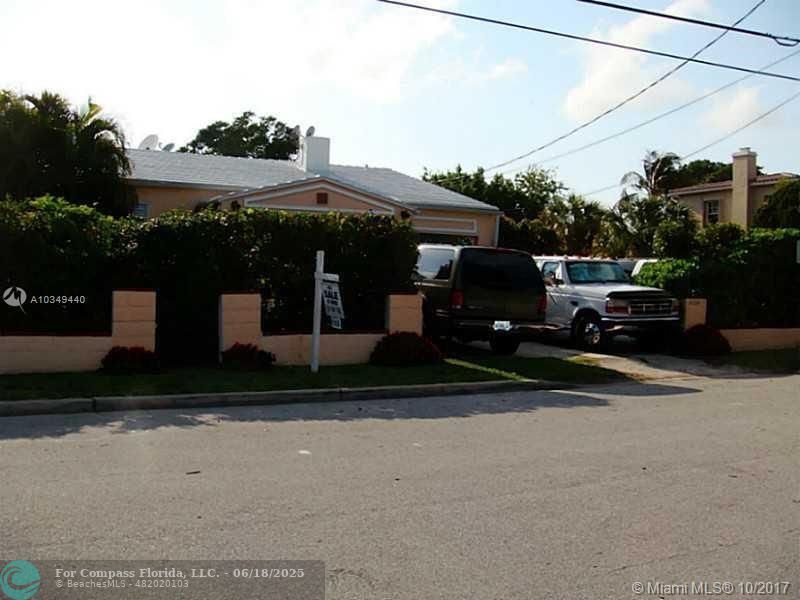 9324 Abbott Avenue Surfside, FL 33154 - Photo 27 of 33 a front view of a house with a yard