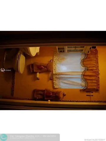 a living room with furniture and a mirror