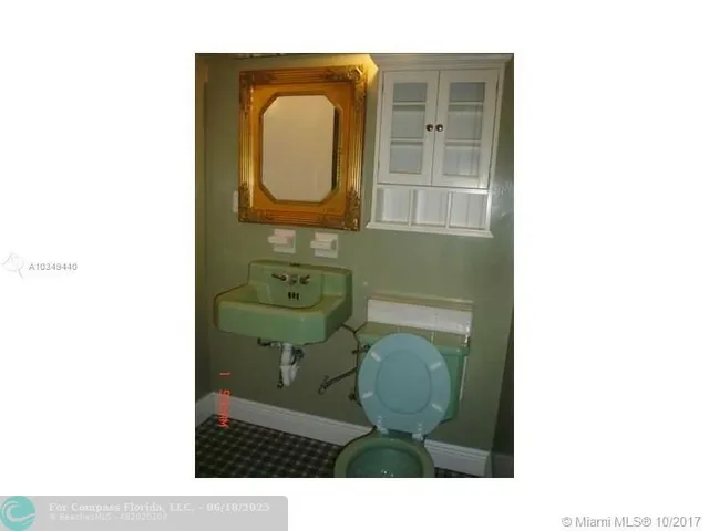 a view of a backyard with sitting area