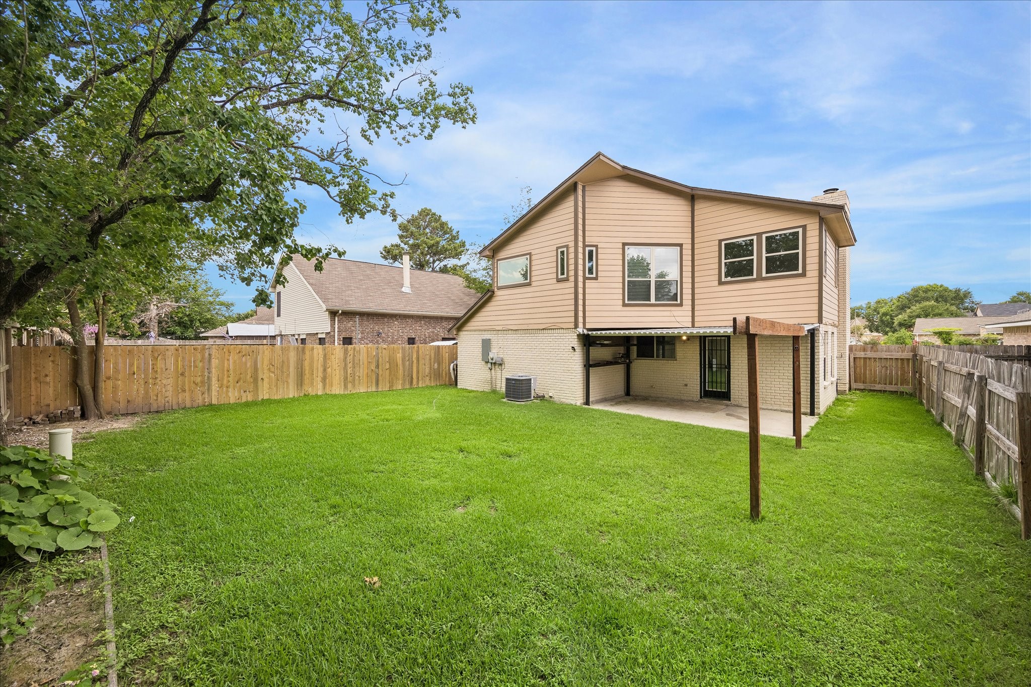 10411 Goodrum Road Houston, TX 77041 - Photo 2 of 25 Offering a huge backayard with covered patio. Clean slate back here and plenty of room for a pool or swingset.