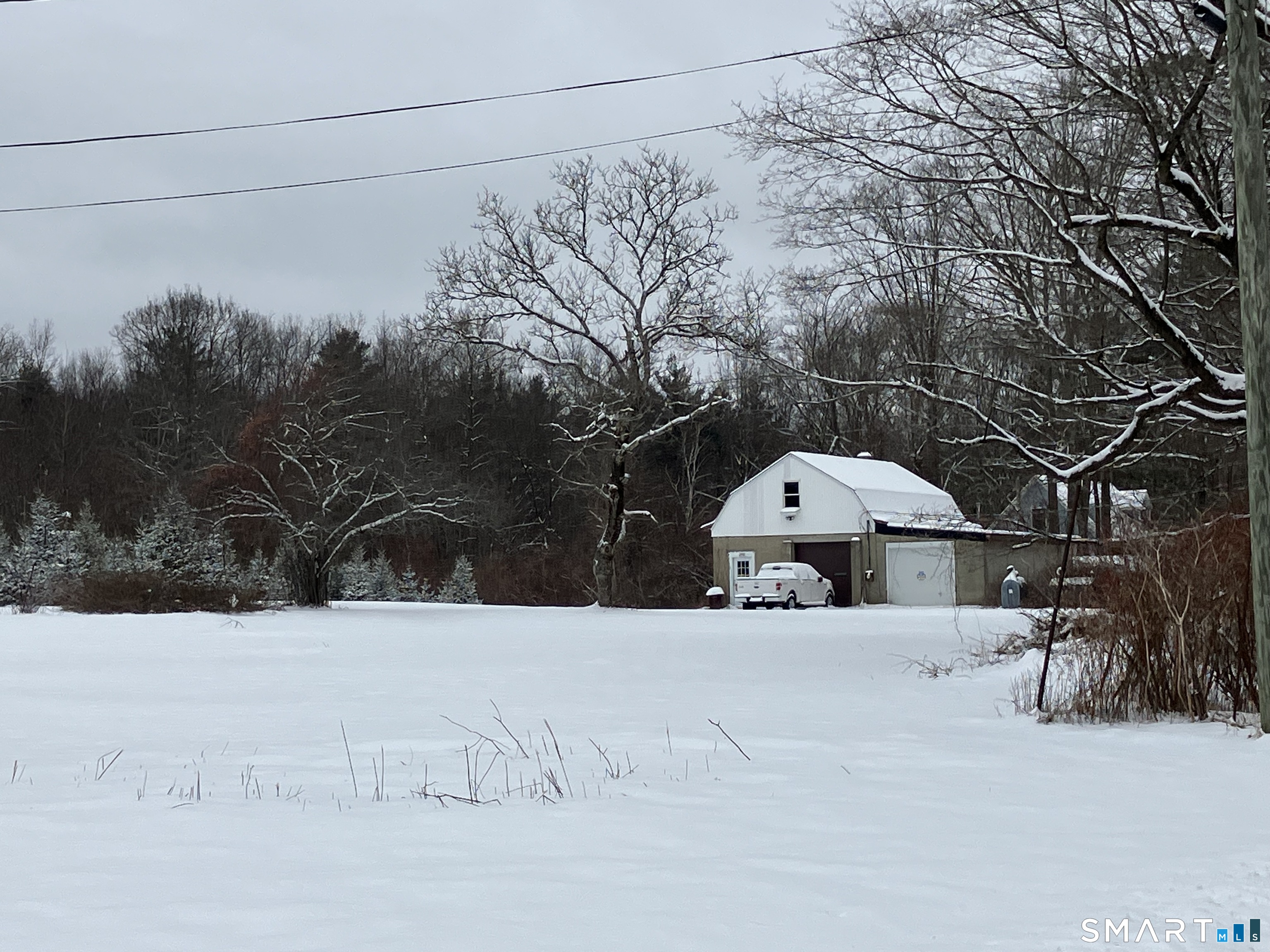 441 Stickney Hill Road Union, CT 06076 - Photo 2 of 11 a view of a road with a snow on the road