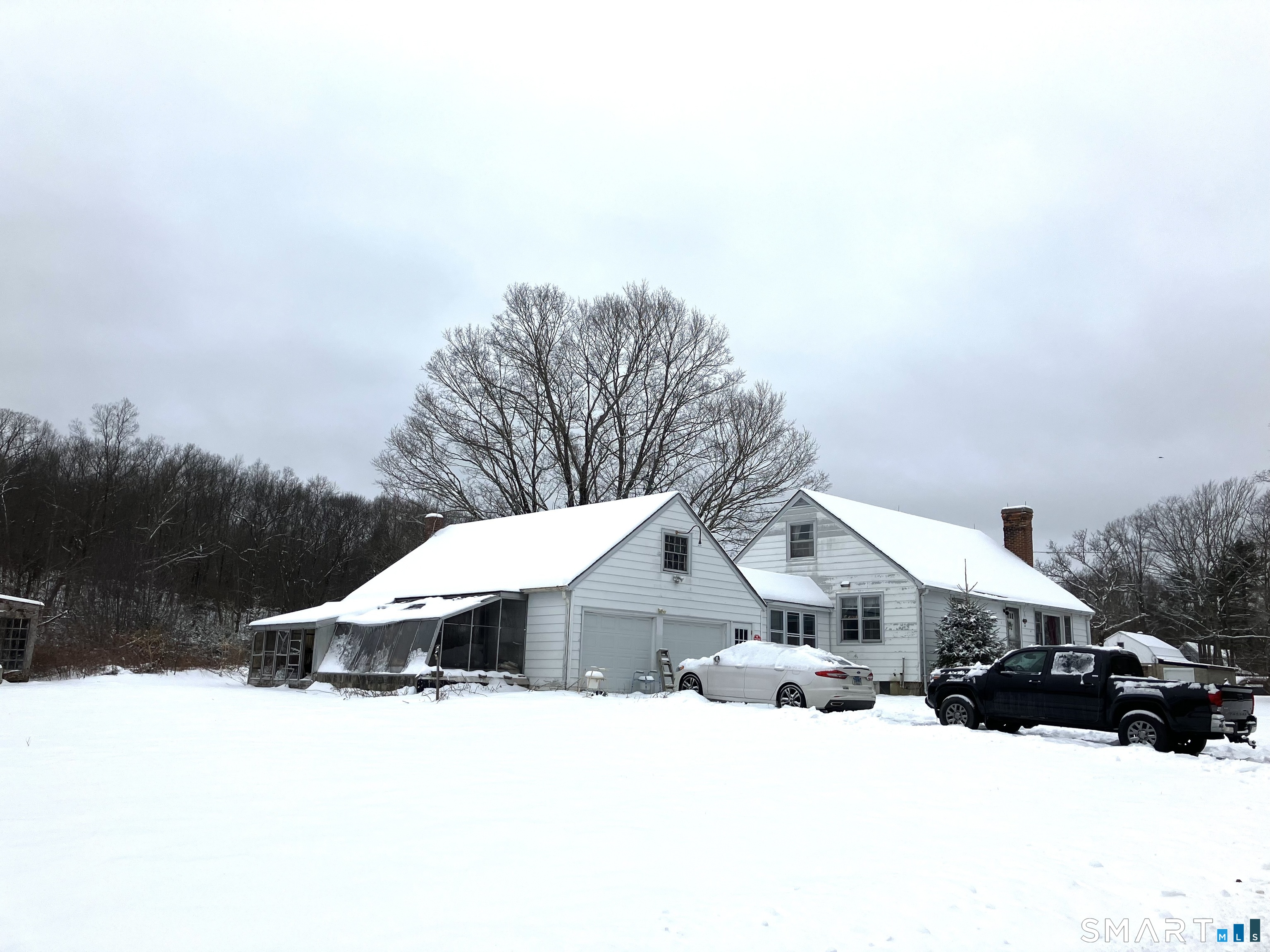 441 Stickney Hill Road Union, CT 06076 - Photo 4 of 11 a view of a house with a yard covered in snow