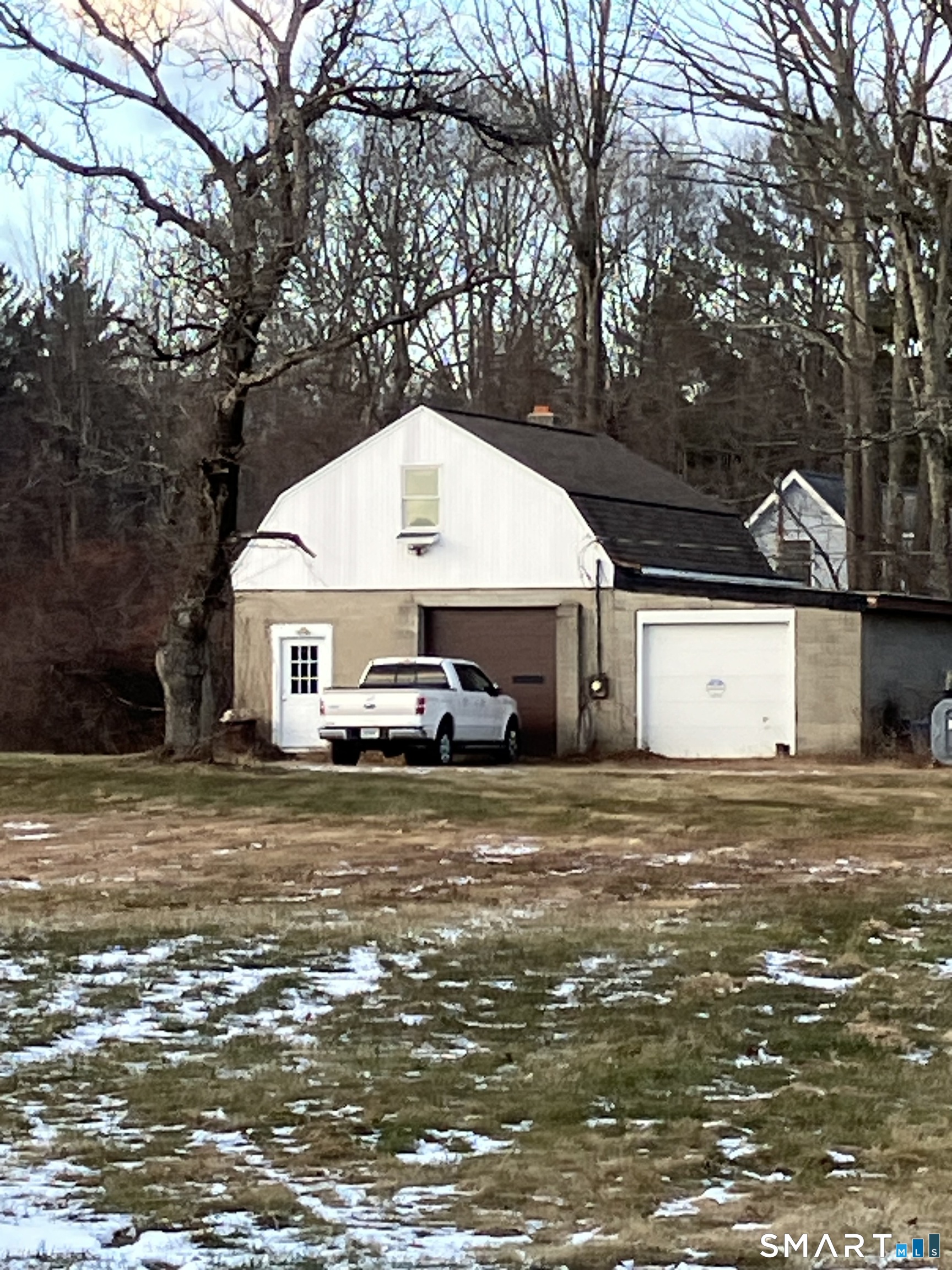 441 Stickney Hill Road Union, CT 06076 - Photo 9 of 11 a front view of a house with a yard and garage