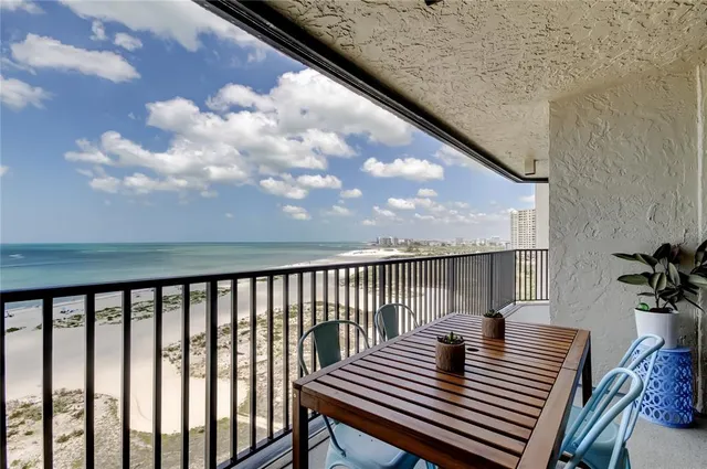a view of balcony with wooden floor