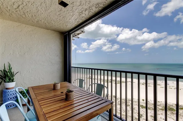 a view of a balcony and wooden floor