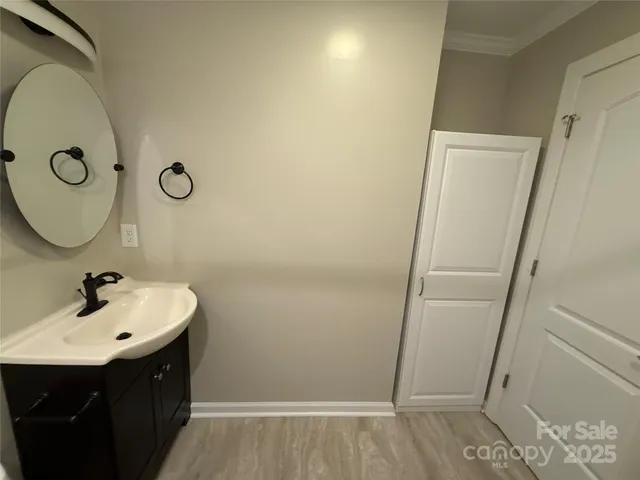 a bathroom with a sink and mirror
