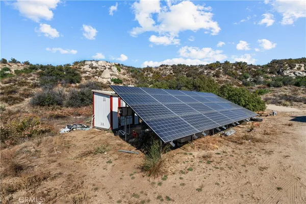 a view of a wooden roof with a yard in back