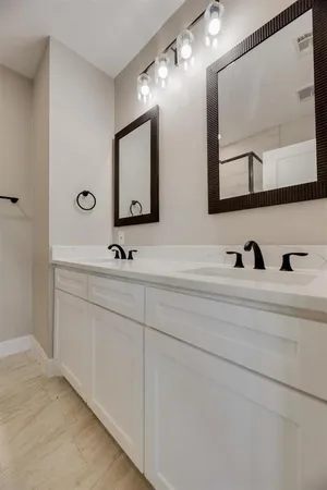 a view of a porch with furniture and garden