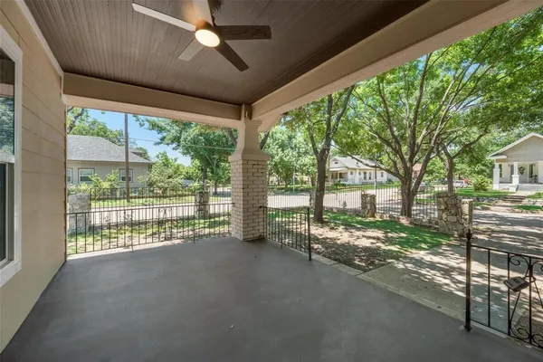 a view of a house with backyard and a porch