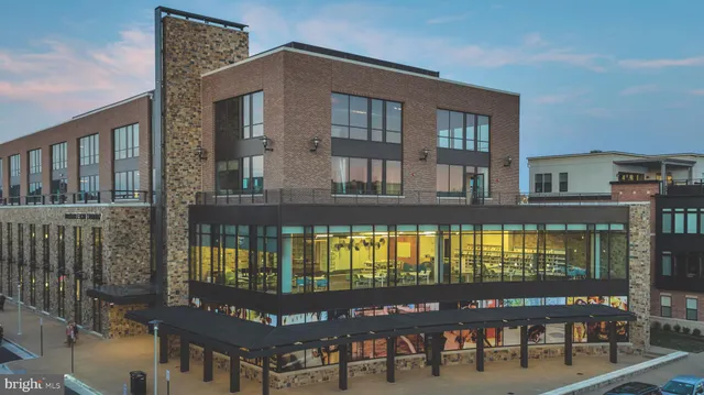 a sign that is sitting in the middle of a garden