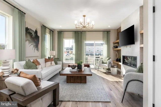 a living room with furniture fireplace and flat screen tv