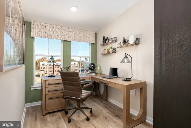 a view of a workspace with furniture