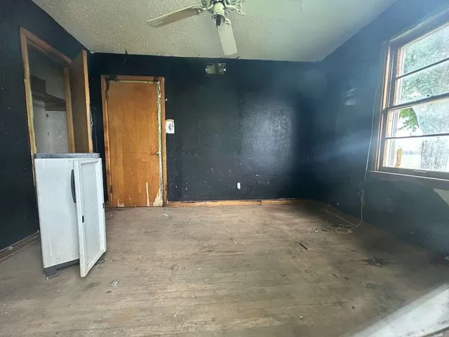an empty room with closet area