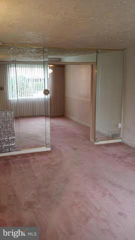 1224 Kevin Road Baltimore, MD 21229 - Photo 3 of 11 a view of an empty room with a window