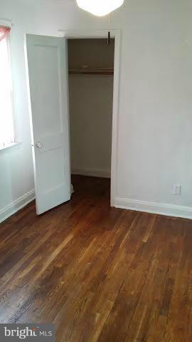 1224 Kevin Road Baltimore, MD 21229 - Photo 7 of 11 an empty room with wooden floor