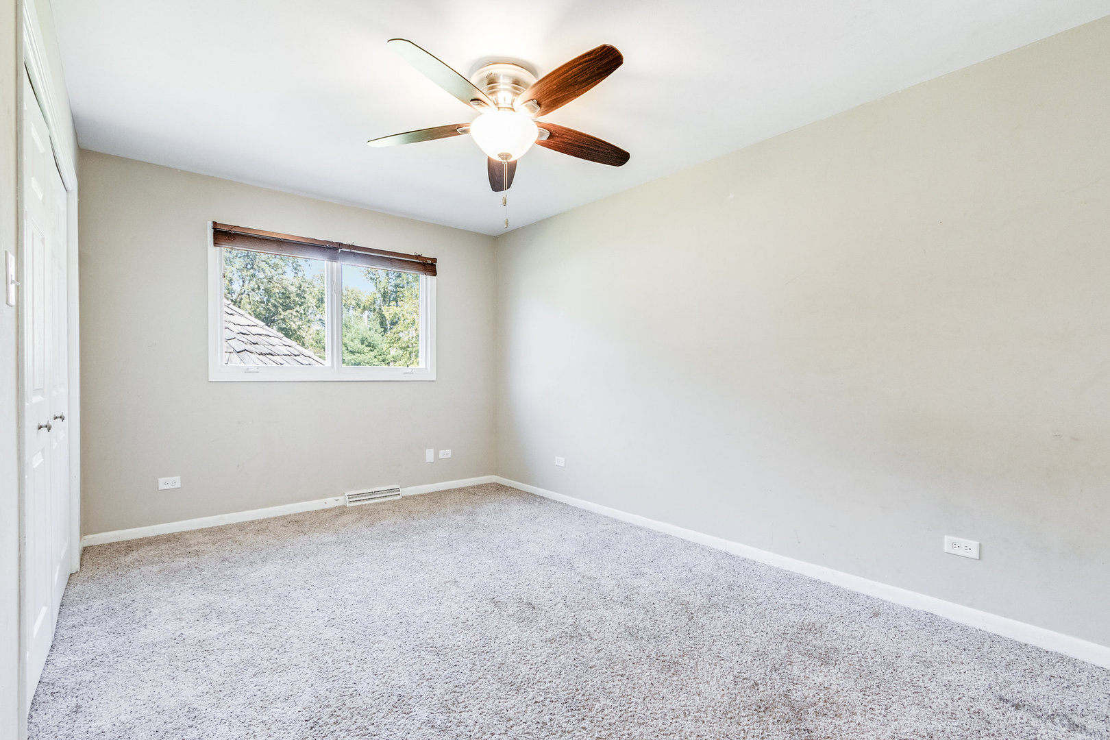 311 West Michigan Road New Lenox, IL 60451 - Photo 8 of 16 an empty room with windows and fan