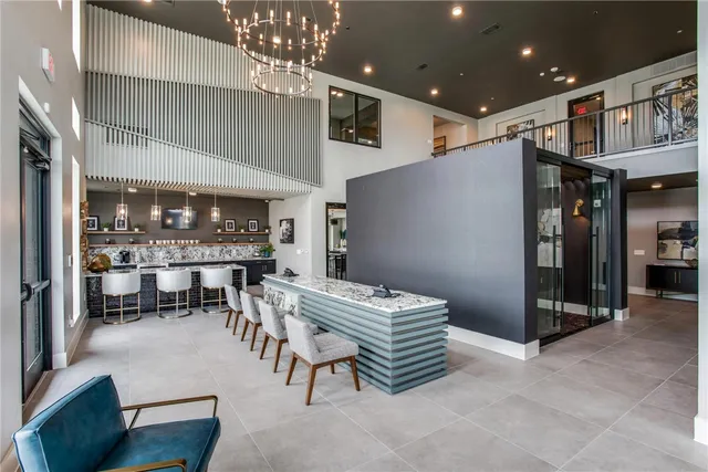 a dining room with furniture and a chandelier