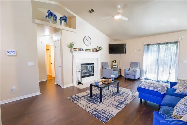 a living room with furniture and a fireplace