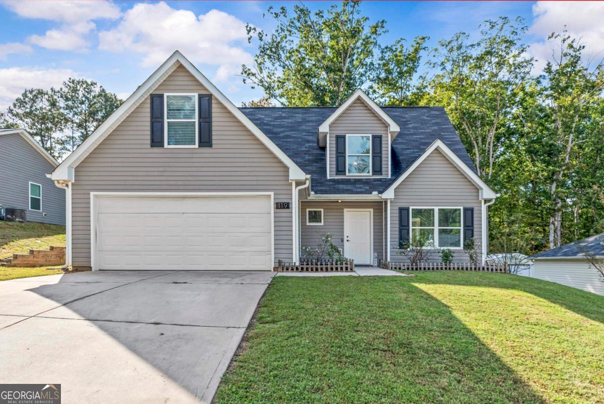 119 Misty Grove Lane Eatonton, GA 31024 - Photo 1 of 1 a view of a house with a yard and large tree