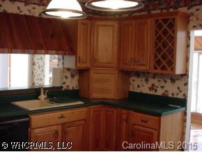 115 Laurel Branch Road Maggie Valley, NC 28751 - Photo 5 of 8 a kitchen with a sink and cabinets