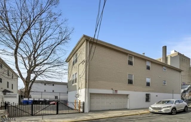 a car parked in front of a white building