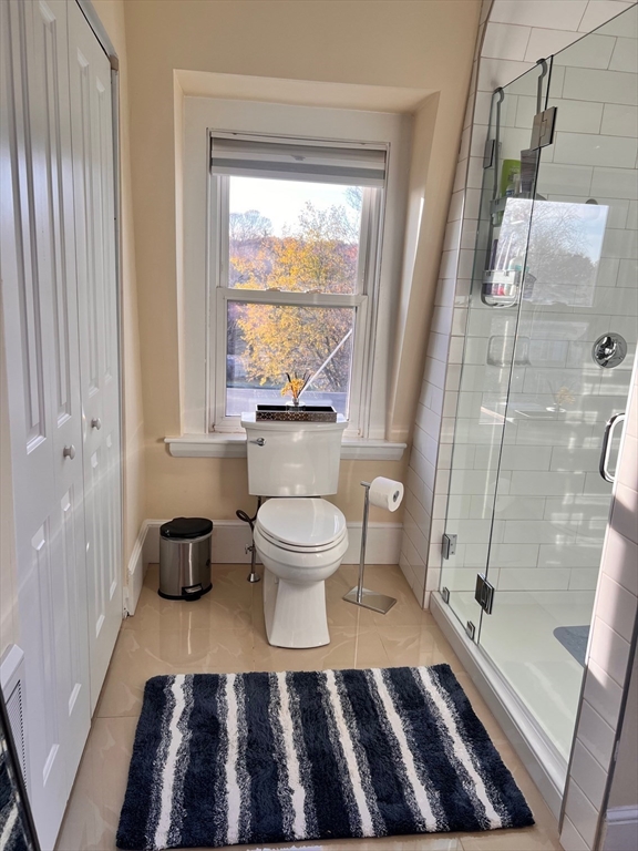17 Emerson Street, Unit 2 Wakefield, MA 01880 - Photo 13 of 22 a bathroom with a toilet and a shower