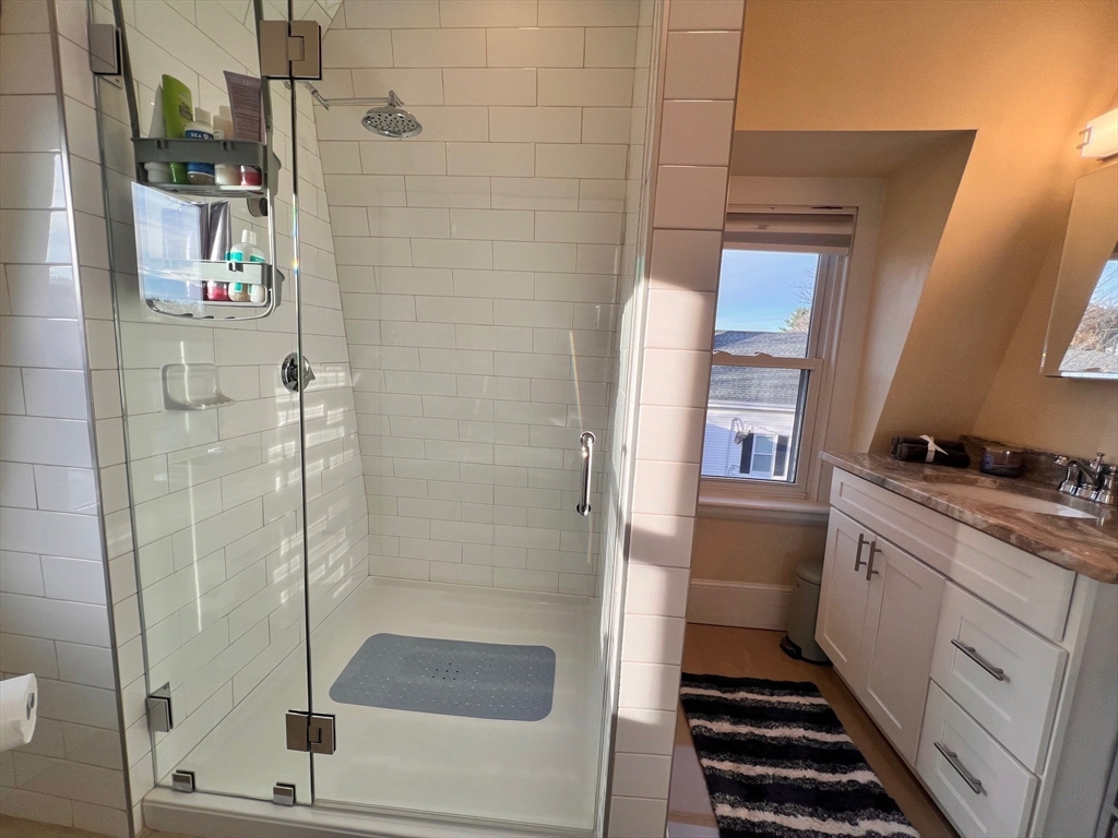17 Emerson Street, Unit 2 Wakefield, MA 01880 - Photo 14 of 22 a bathroom with a shower and a sink