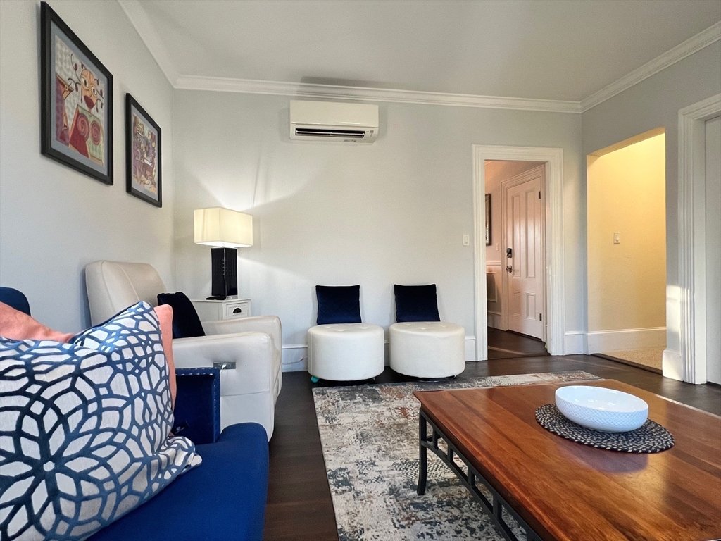 17 Emerson Street, Unit 2 Wakefield, MA 01880 - Photo 18 of 22 a living room with furniture and a wooden floor