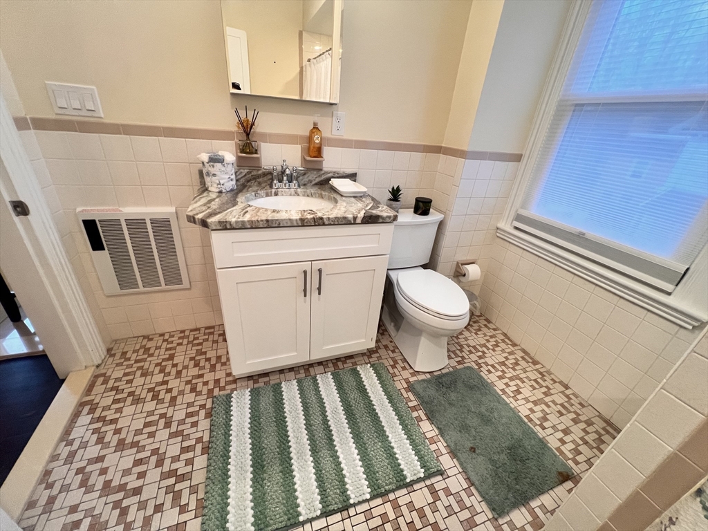 17 Emerson Street, Unit 2 Wakefield, MA 01880 - Photo 21 of 22 a bathroom with a sink toilet and shower
