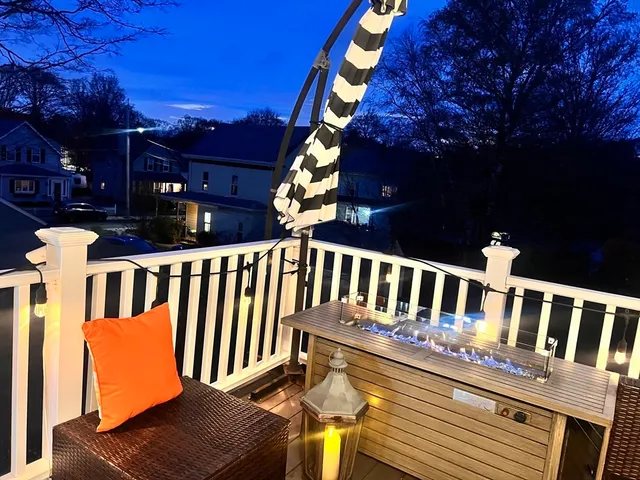 a view of a chair and table in the balcony