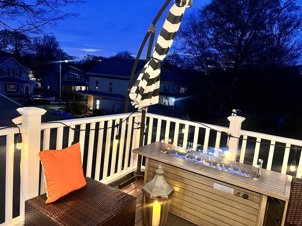 17 Emerson Street, Unit 2 Wakefield, MA 01880 - Photo 22 of 22 a view of a chair and table in the balcony