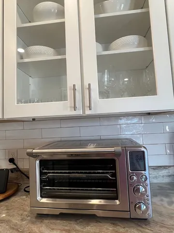 a bathroom with a stove and a sink