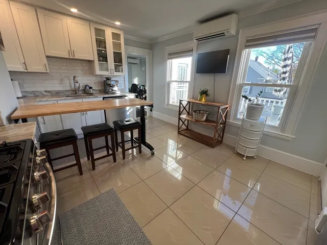 a kitchen with granite countertop a sink and a stove top oven