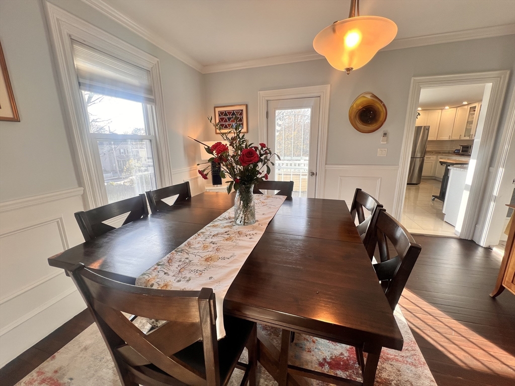 17 Emerson Street, Unit 2 Wakefield, MA 01880 - Photo 7 of 22 a view of a dining room with furniture and wooden floor