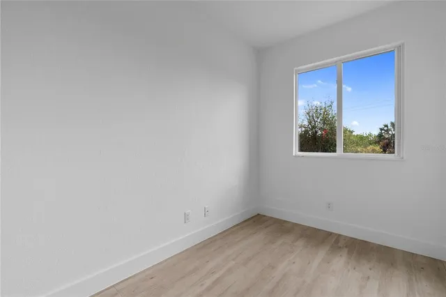 a view of an empty room with a window