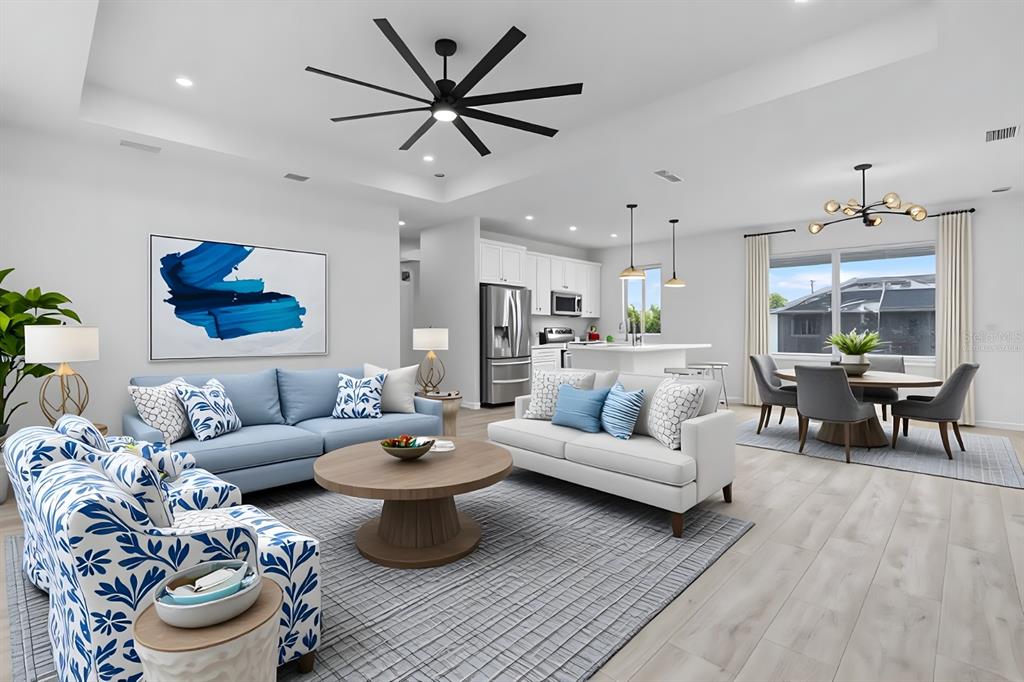 13438 Mc Intosh Avenue Port Charlotte, FL 33981 - Photo 2 of 46 a living room with furniture and a large window