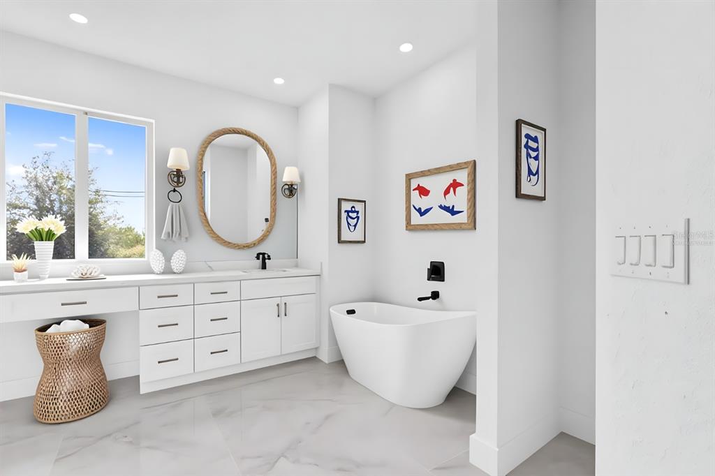 13438 Mc Intosh Avenue Port Charlotte, FL 33981 - Photo 22 of 46 a spacious bathroom with a double vanity sink and a mirror