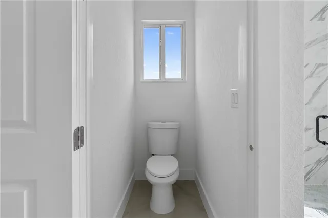 a bathroom with a toilet
