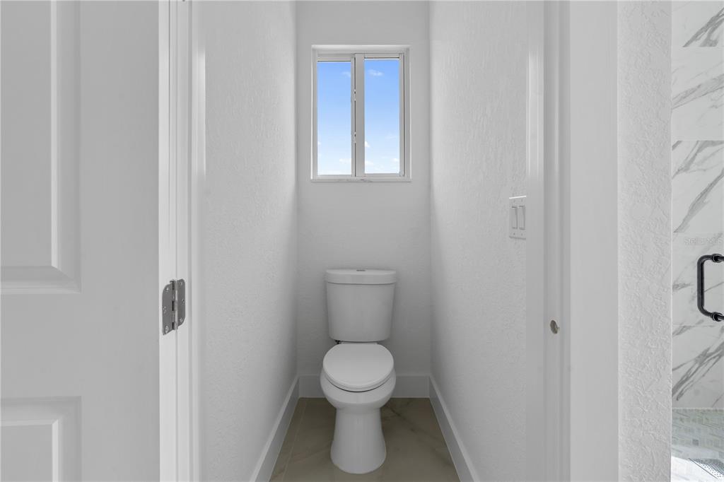 13438 Mc Intosh Avenue Port Charlotte, FL 33981 - Photo 27 of 46 a bathroom with a toilet