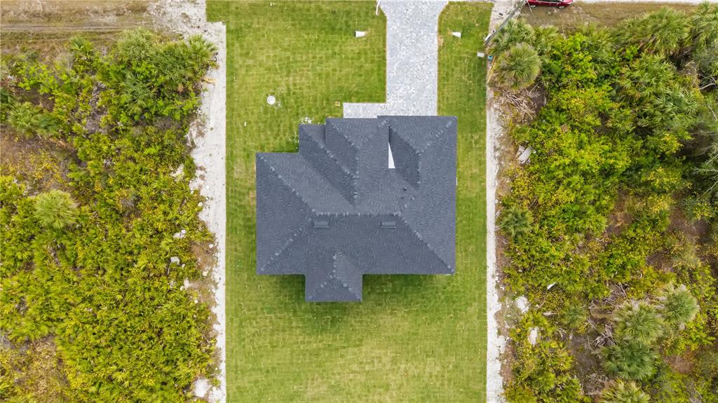 13438 Mc Intosh Avenue Port Charlotte, FL 33981 - Photo 40 of 46 view of a house with a yard