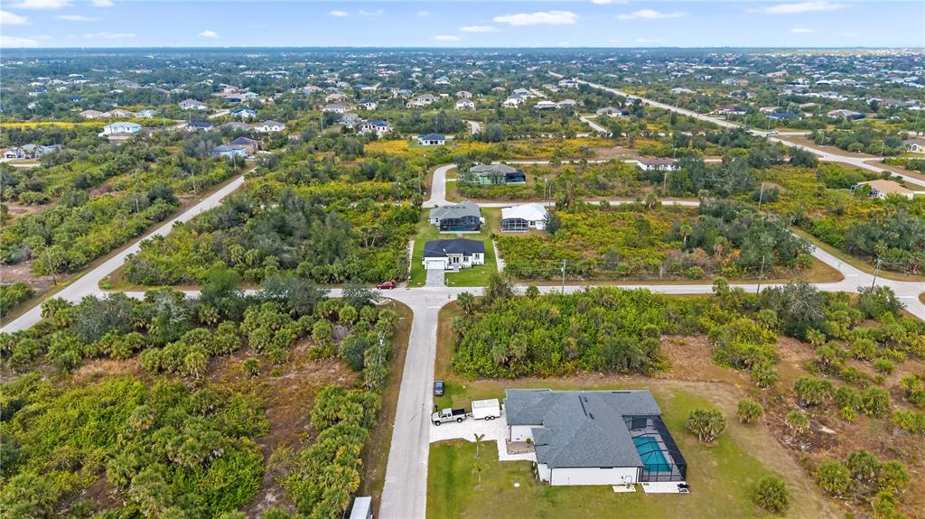 13438 Mc Intosh Avenue Port Charlotte, FL 33981 - Photo 41 of 46 an aerial view of residential houses with outdoor space