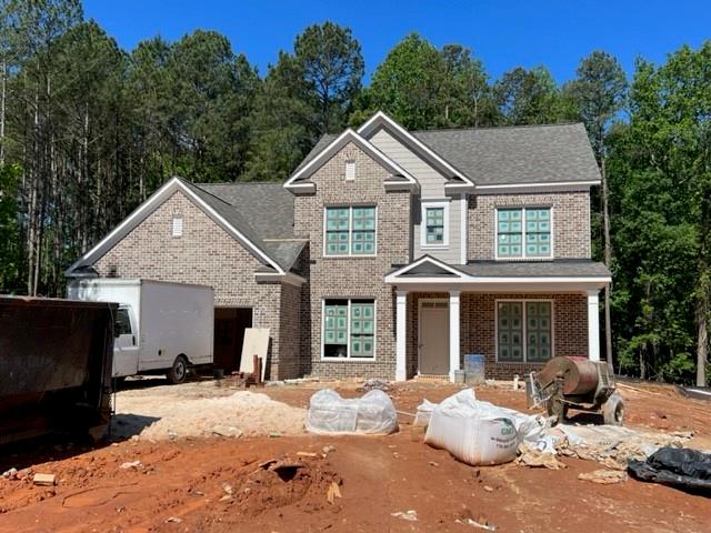 5568 Suwanee Dam Road Sugar Hill, GA 30518 - Photo 1 of 1 a front view of a house with a yard and outdoor seating