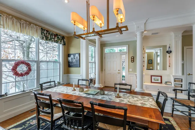a dinning table and chairs in a room
