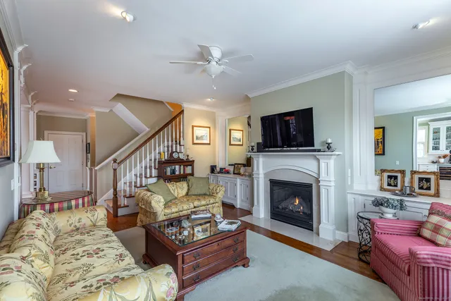a living room with furniture fireplace and flat screen tv