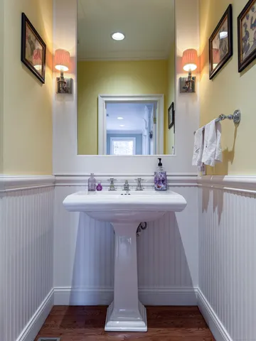 a bathroom with a sink vanity and a mirror
