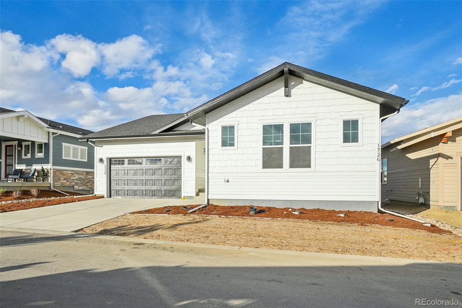 1726 Morningstar Way Fort Collins, CO 80524 - Photo 1 of 50 a view of a house with a backyard