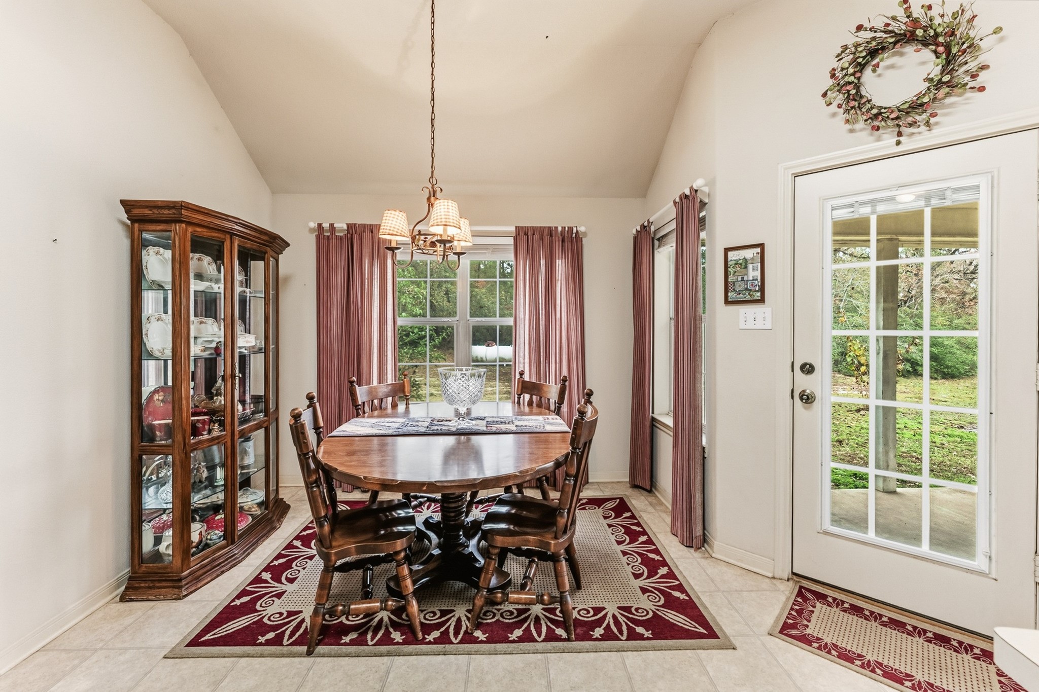 691 Bishop Road Huntsville, TX 77320 - Photo 14 of 32 a dining room with chandelier and wooden floor