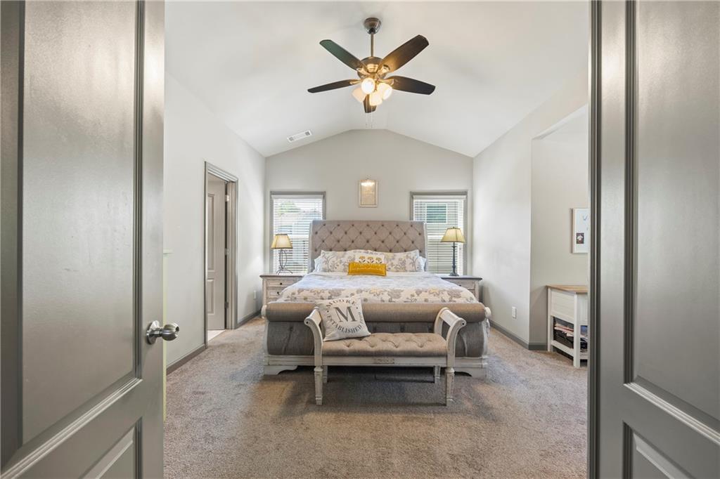 816 Mimosa Way Jefferson, GA 30549 - Photo 15 of 30 a bed room with a bed and a chandelier